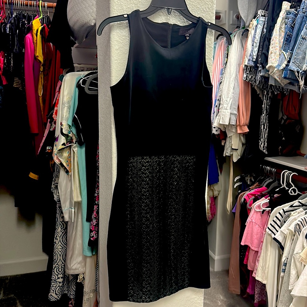 Black dress knee length with a bottom front design in black and silver